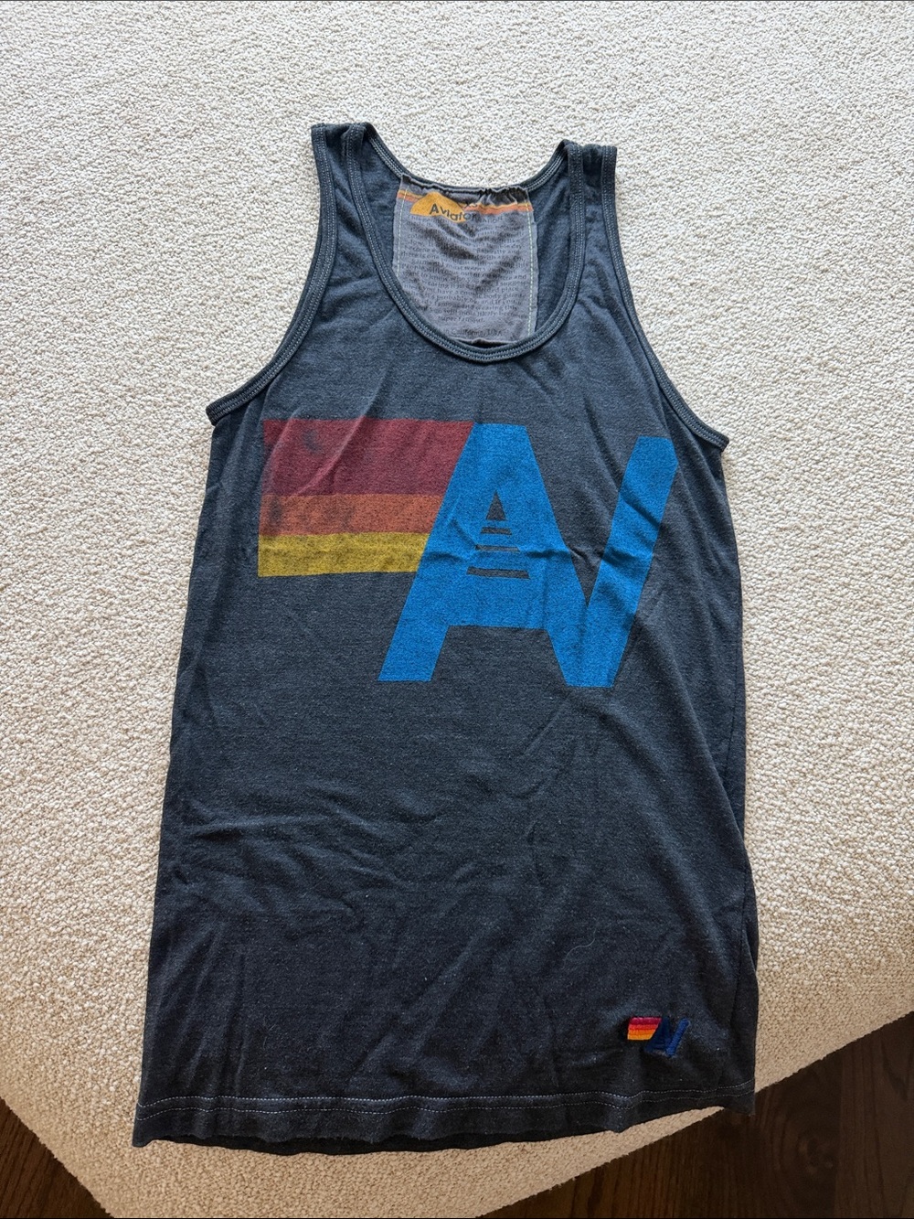 Aviator Nation Black Tank with Blue AV Logo and Red-Yellow Stripe